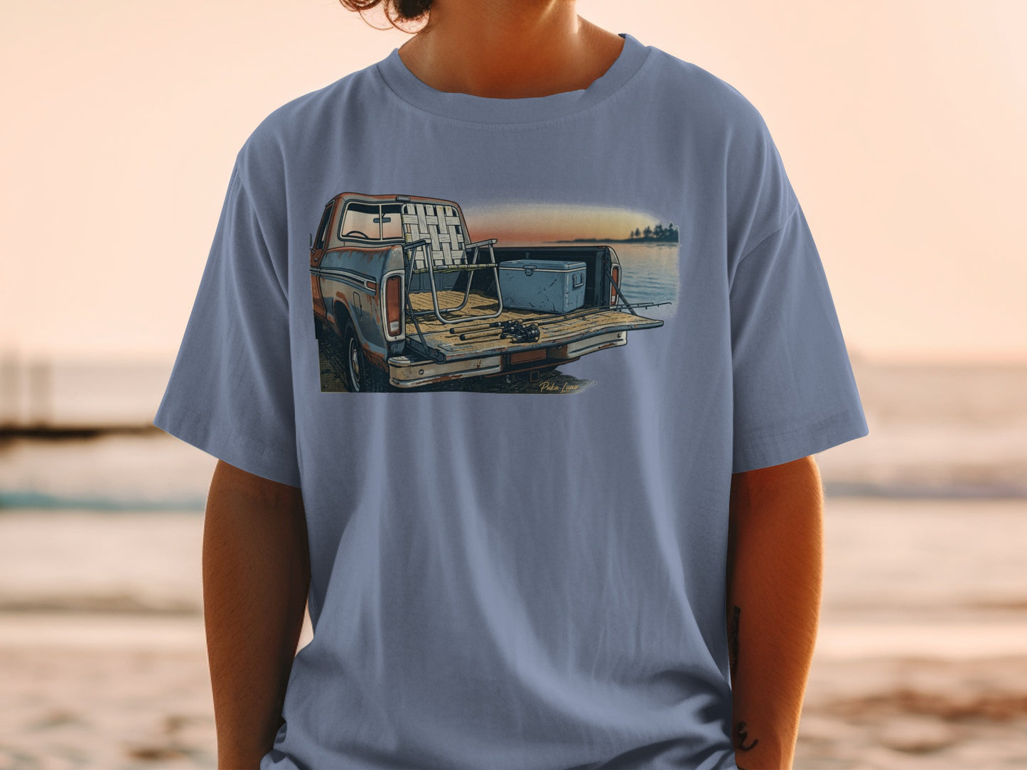 T-shirt with illustration of a pickup truck bed filled with fishing gear.