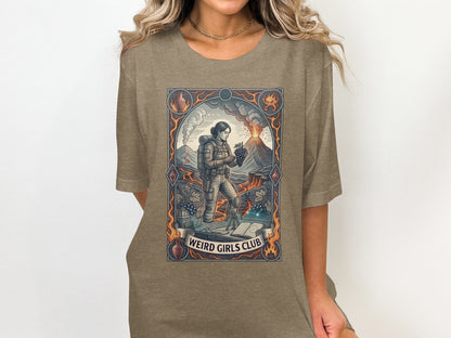 Graphic t-shirt with "Weird Girls Club" text and volcano, grape, and book illustrations.