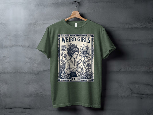 T-shirt featuring "Weird Girls Club" with a woman examining a flower.