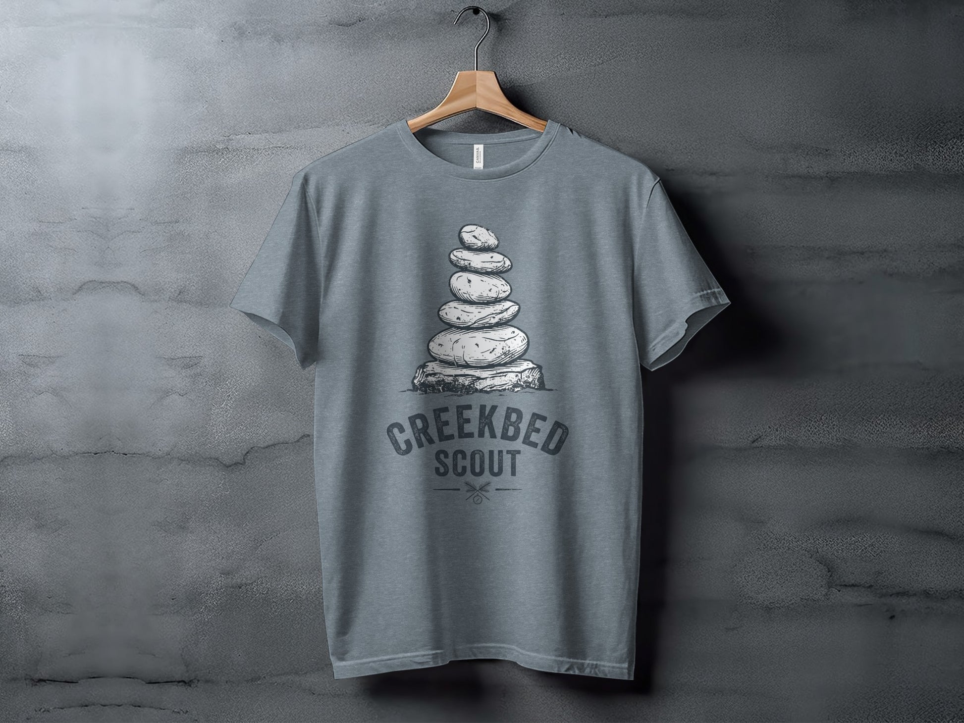 Creekbed Scout Cairn Graphic: The Explorer's Adventure Tee: Gray t-shirt with stacked stones and "Creekbed Scout" text.