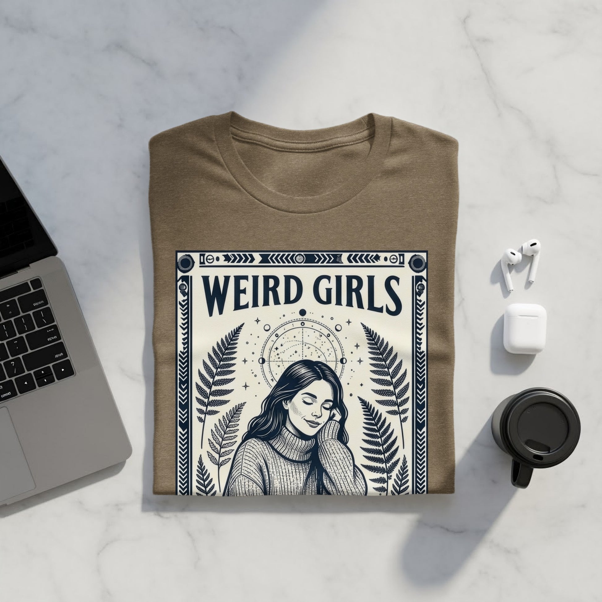 Brown t-shirt with "WEIRD GIRLS" text and celestial design.