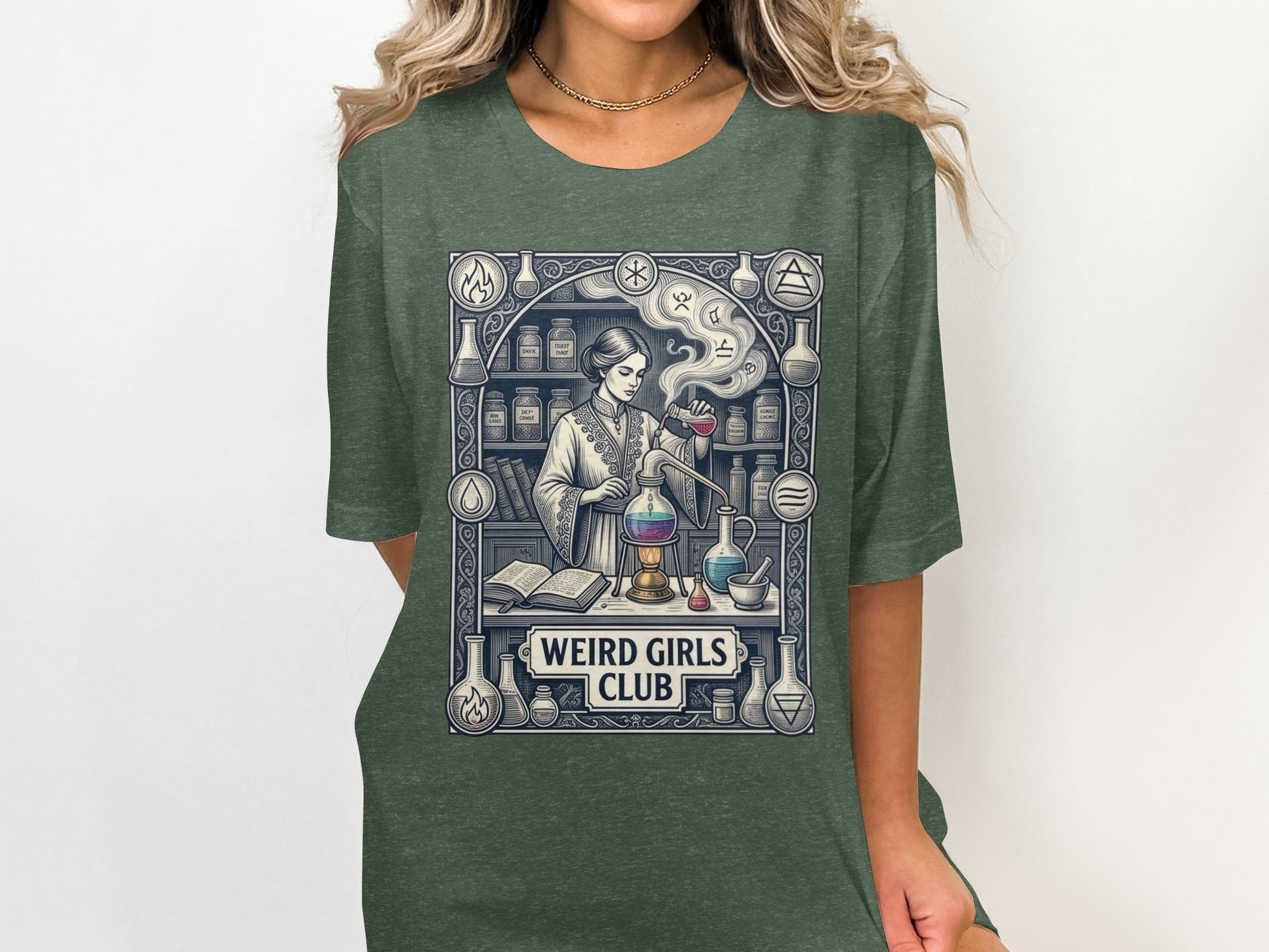 Woman in dark green t-shirt with "Weird Girls Club" chemistry illustration.