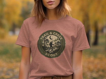 Heritage Trail & Creek Scout Adventure Nomad Tee: Brown t-shirt with circular "Trail & Creek Scout" logo depicting hikers and trees.