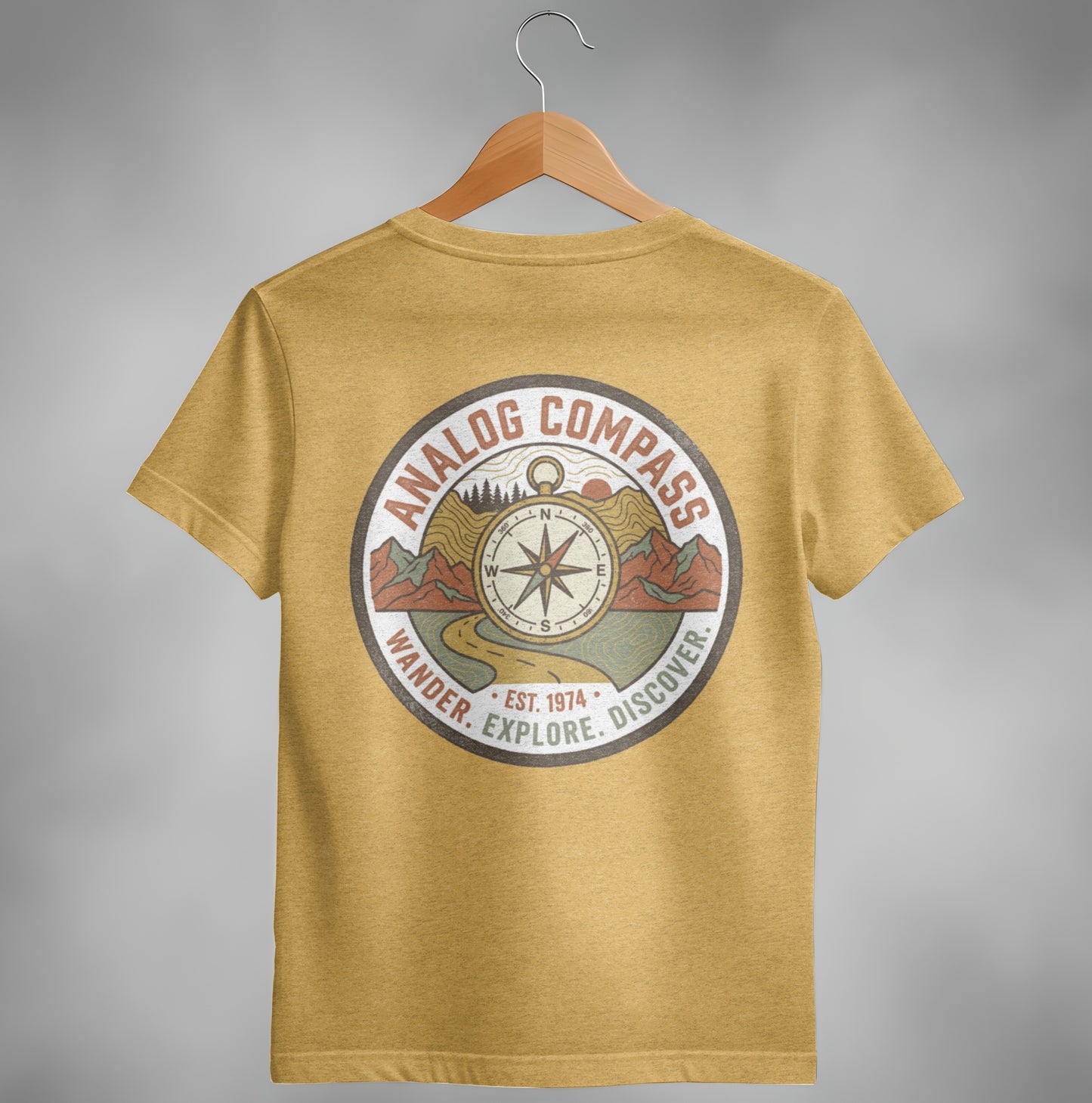 Yellow t-shirt with a circular "Analog Compass" graphic featuring a compass rose and landscape.