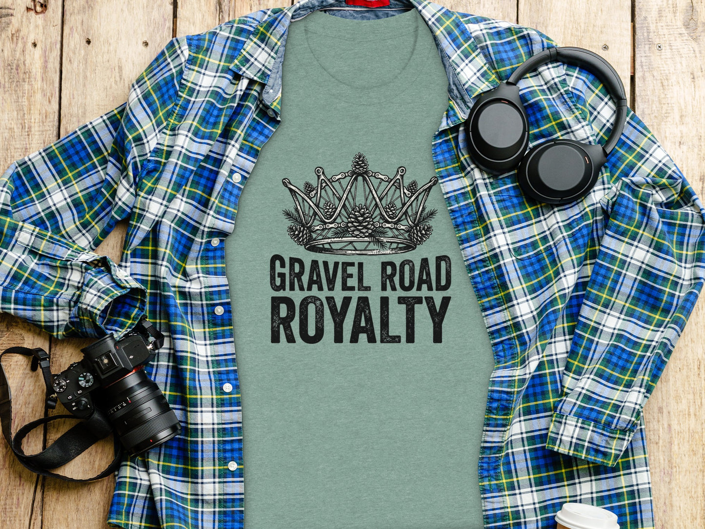 Gravel Road Royalty: Backcountry Outpost Shirt: T-shirt with "Gravel Road Royalty" and crown graphic, laid flat with headphones and camera.