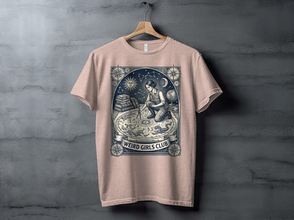 T-shirt with celestial map and "Weird Girls Club" text.