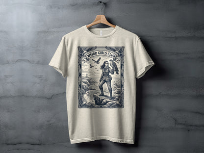 T-shirt with "Weird Girls Club" text above a woman with a hawk by the sea.
