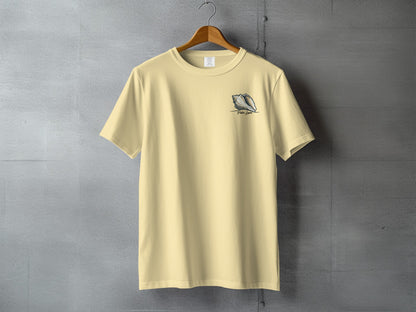 Light yellow t-shirt with a seashell graphic and text.