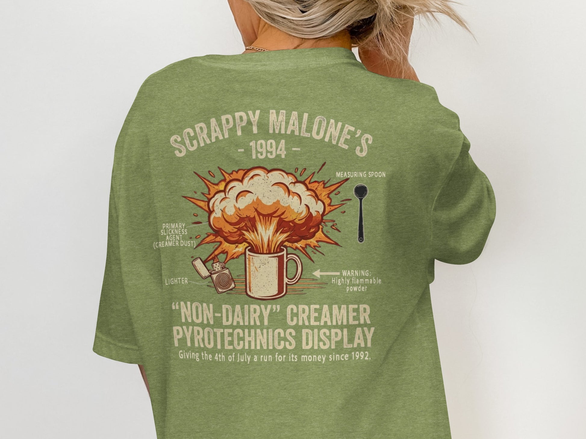 Green t-shirt with "Scrappy Malone's 1994" and fireworks display art.