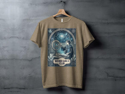T-shirt graphic: woman at orrery, stars, "Weird Girls Club" text.