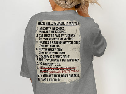 Grey t-shirt with text listing "House Rules & Liability Waiver" and ten numbered rules.