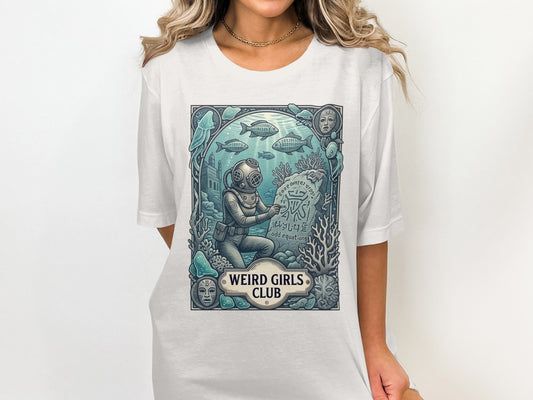 Scuba diver next to stone tablet with "Weird Girls Club" text.