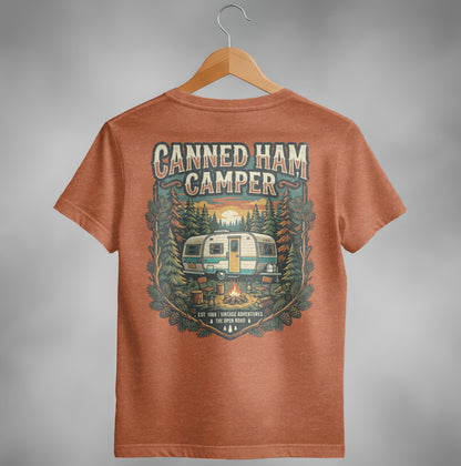 Orange t-shirt with vintage camper, campfire, and forest graphic.