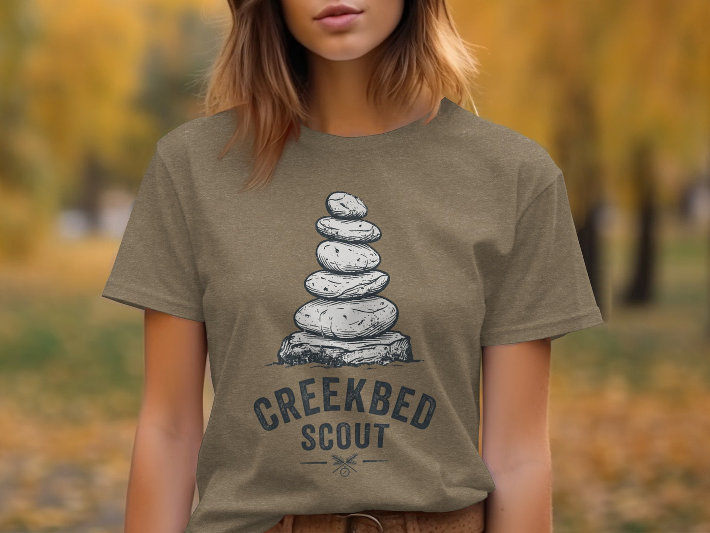 Creekbed Scout Cairn Graphic: The Explorer's Adventure Tee: T-shirt with stacked stones and "CREEKBED SCOUT" text.